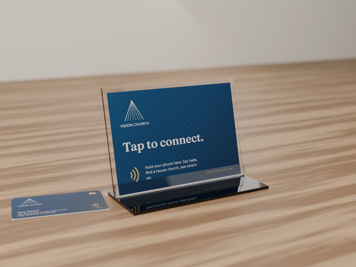 Vision Church's Tap Stand: an acrylic holder with a printed Tap to connect card